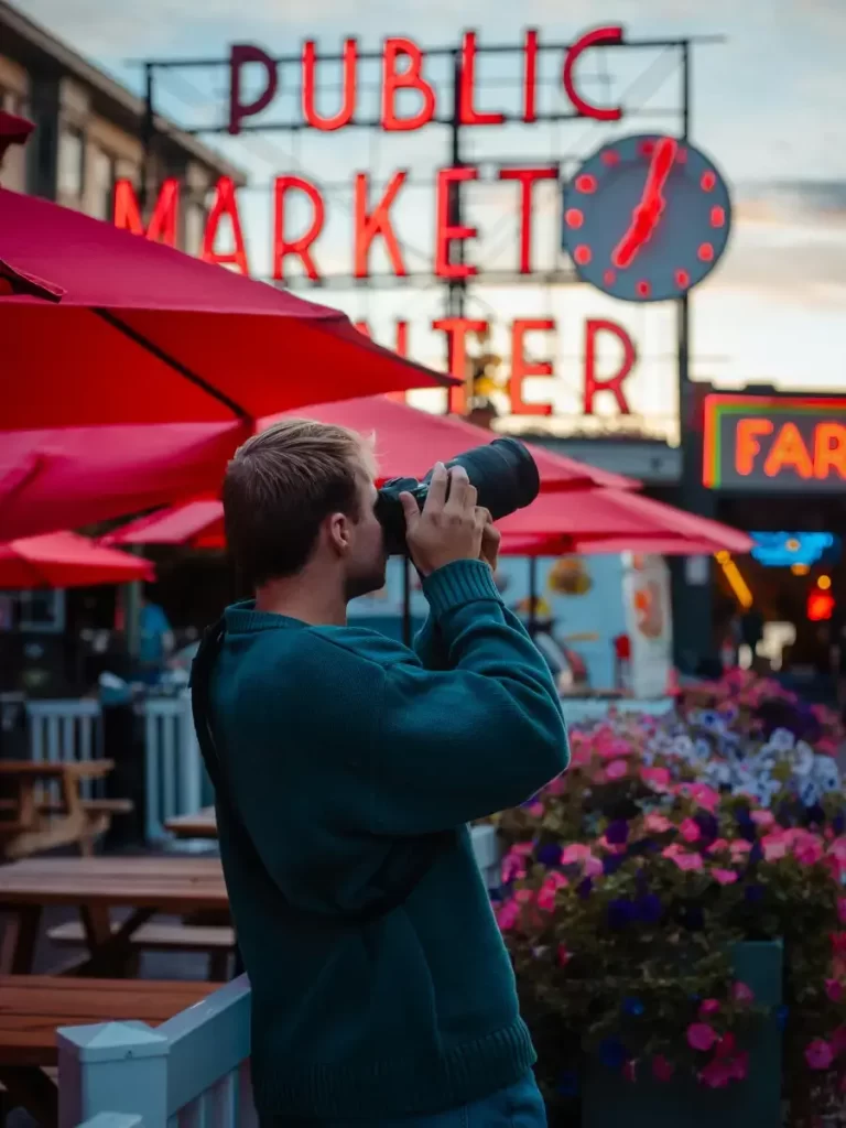 Man Taking a Photo in Pike Place Market Public Market Seattle